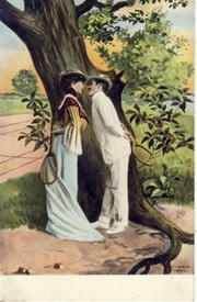 TENNIS COUPLE COURTING UNDER A TREE WITH RACQUETS IN HAND