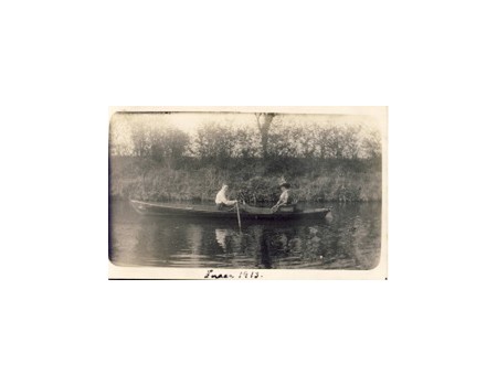 COUPLE IN A ROWING BOAT ON GENTLE WATER POSTCARD